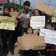One woman (front, center) holds a sign that says: “My Chinese Dream is justice and fairness.” Another woman’s sign says: “My Chinese Dream is that Xi Jinping protects my personal safety and reproductive rights.”